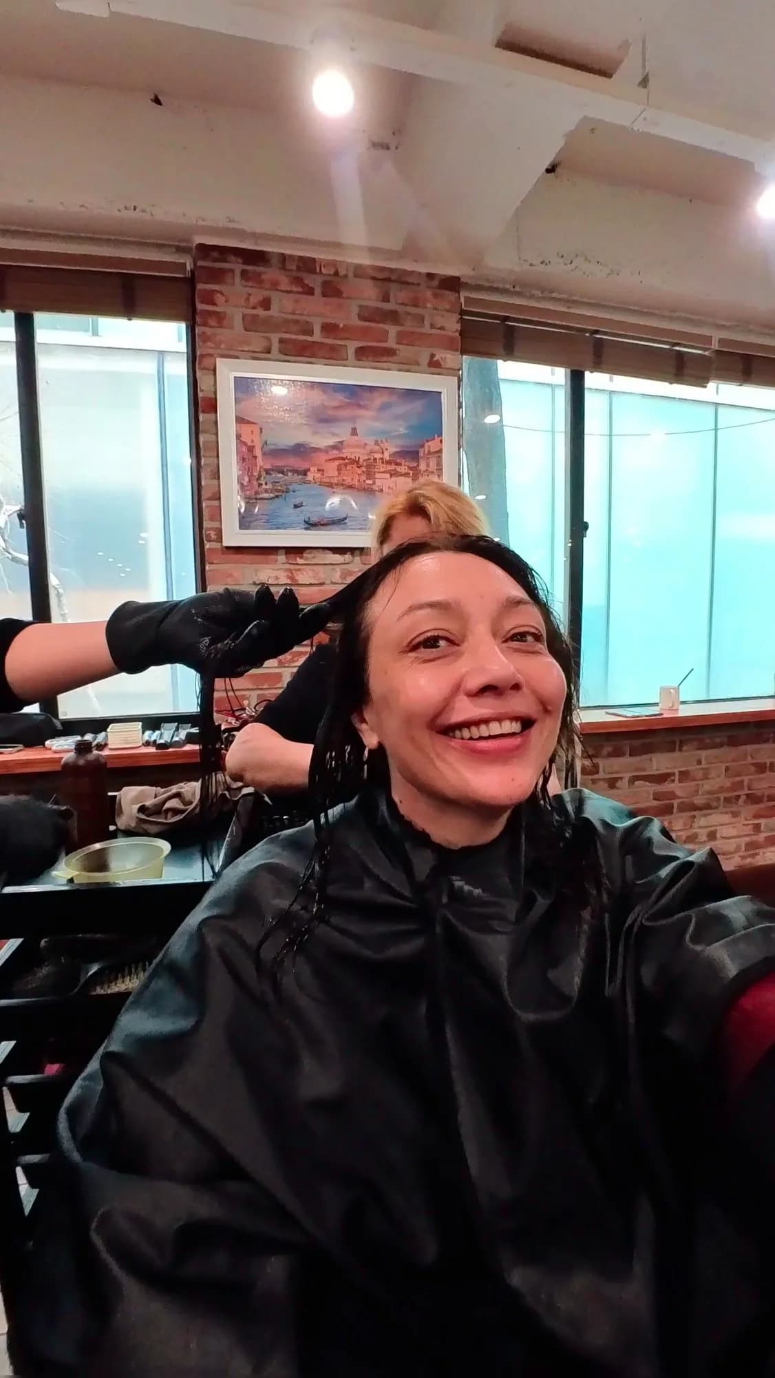 Oksana Prisyazhnaya in a hairdresser chair in Seoul