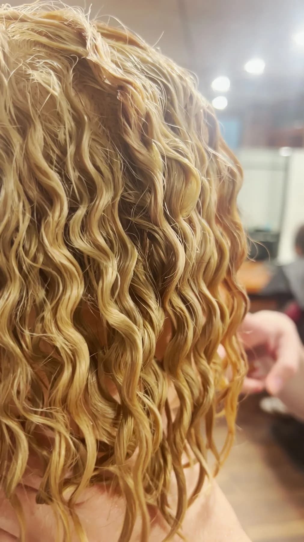 Curls on a training head after a cold perm